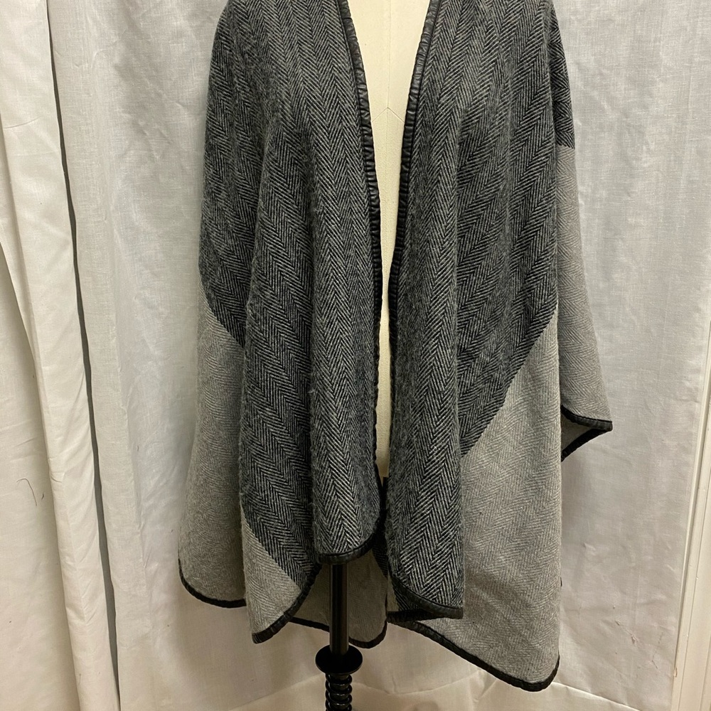 7) Charlie Paige black and grey cape.